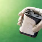 Female hands wearing professional glove with white and black mod