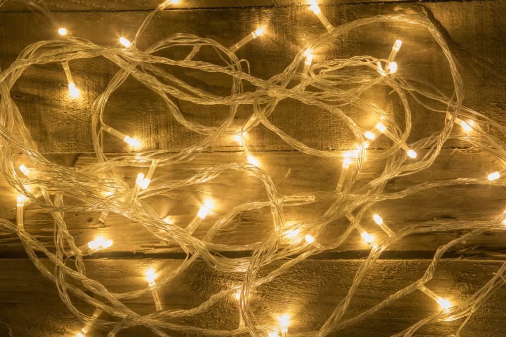 Christmas lights on vintage wooden background