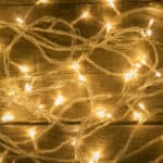 Christmas lights on vintage wooden background