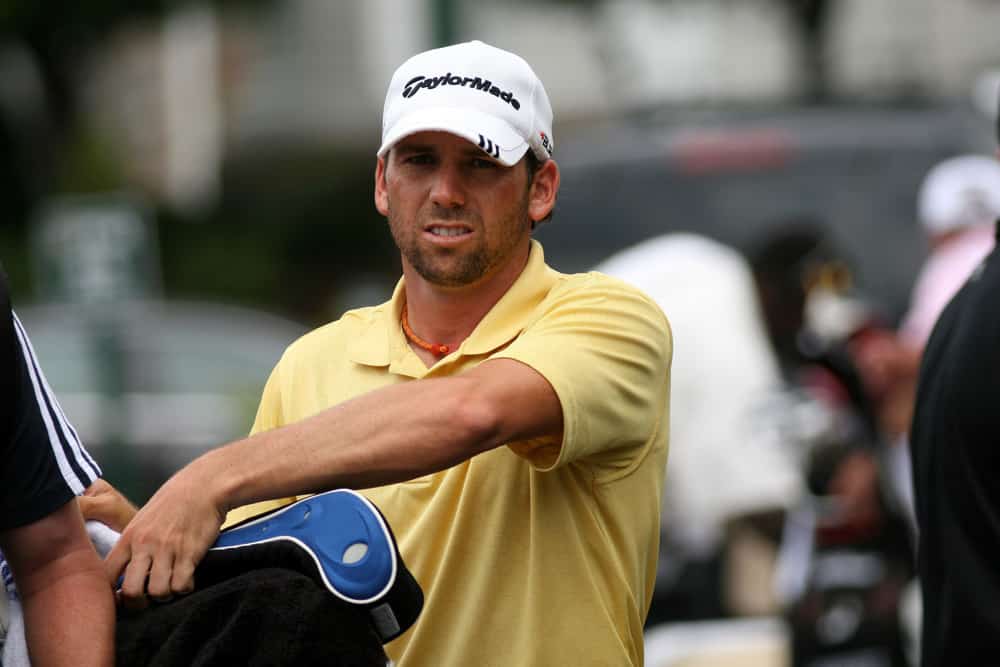 Sergio Garcia waits outside the clubhouse during the third round rain delay of the 90th PGA Championship held at Oakland Hills Country Club in Bloomfield Township, Michigan.