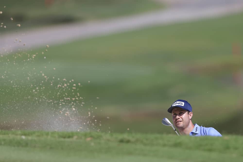 Harris English hits out of the bunker on the 9th green during the first round of the TOUR Championship on September 4, 2020 at the East Lake Golf Club in Atlanta, GA. 