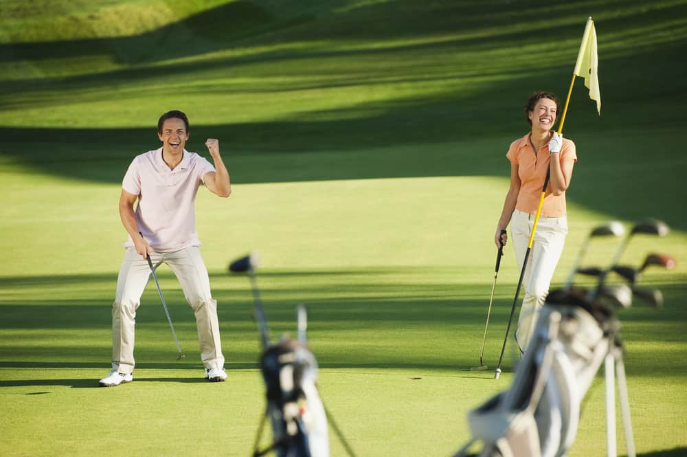 Golfers playing golf on golf course