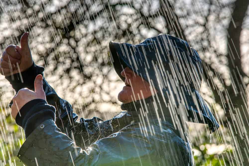 Man in rainwear raincoat and rain hat