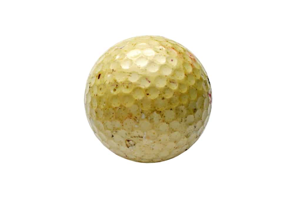 Old yellowed golf ball