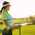 Professional female golfer holding golf club