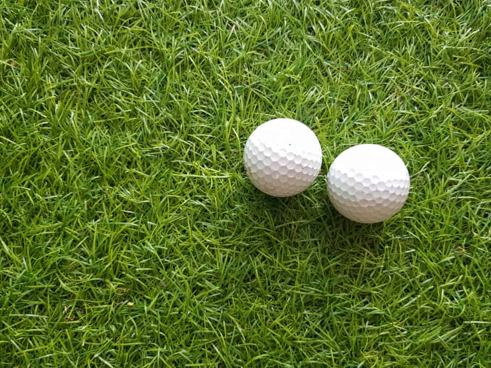 Two golf ball on grass