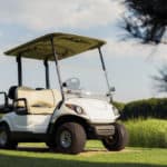 View from low angle, white golf cart