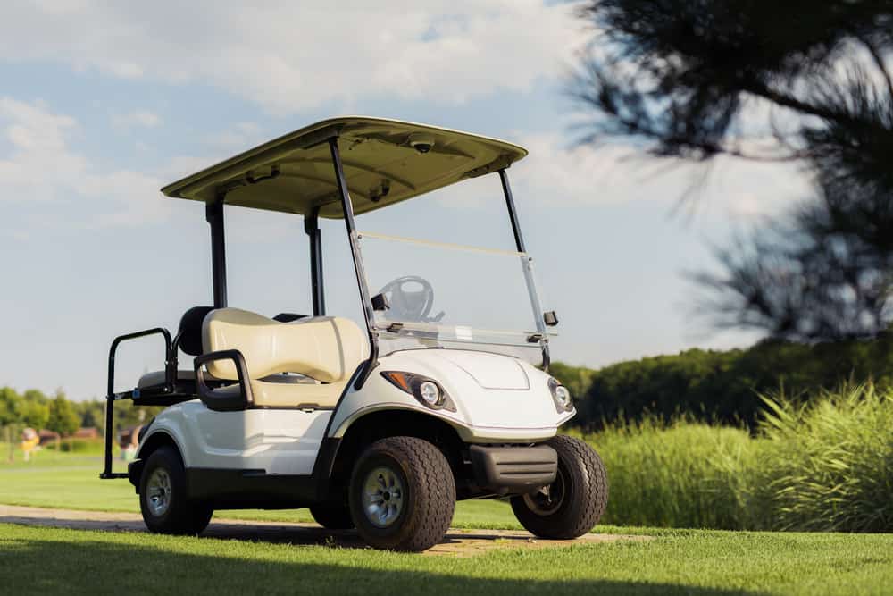 View from low angle, white golf cart