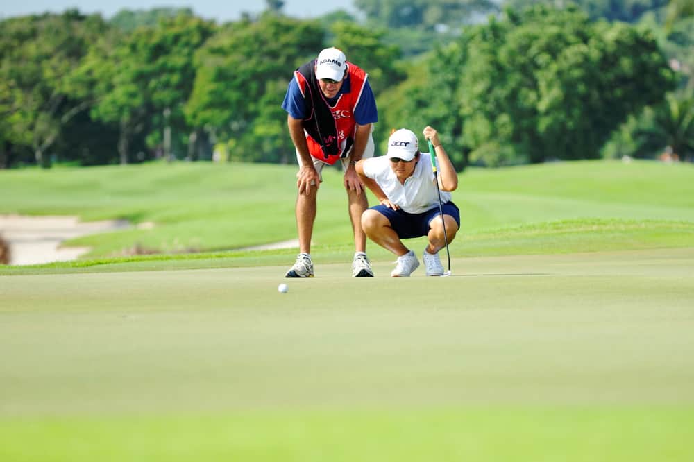 Yani Tseng aiming with her caddie