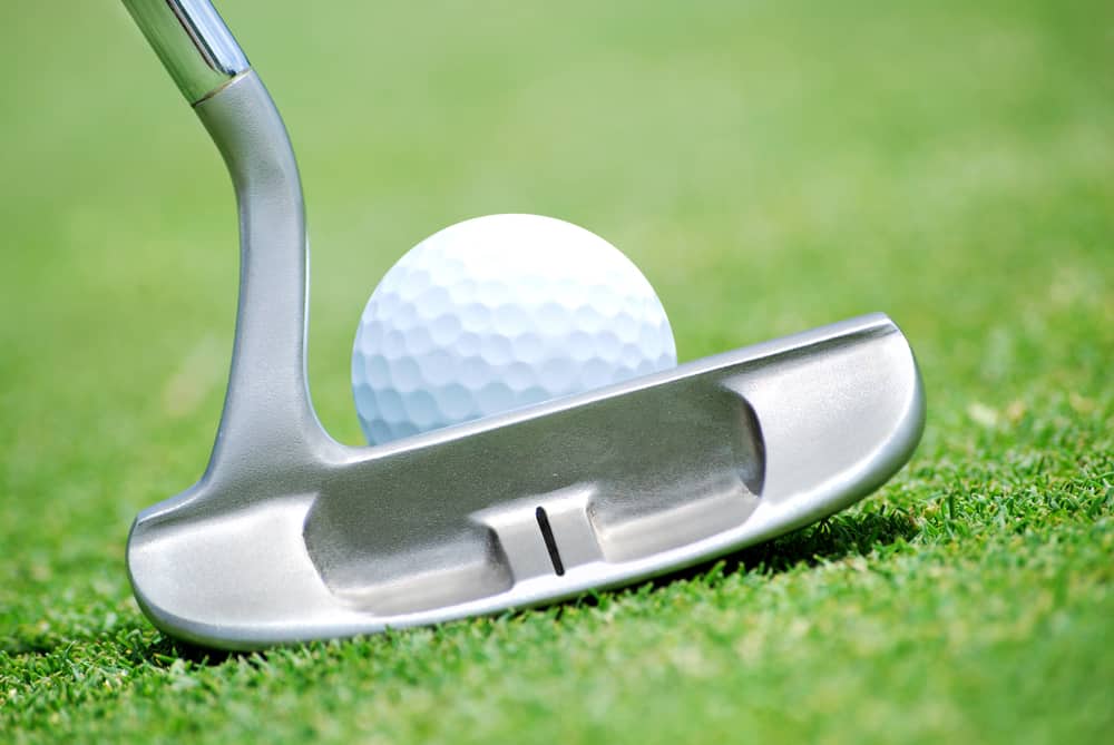 close of putter and ball