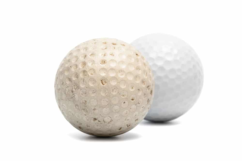 old and new golf ball