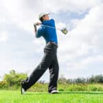 Asian golfer hit a golf ball