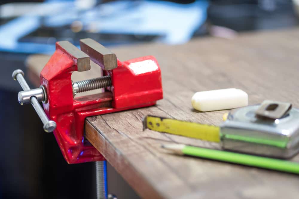 red tabletop mounted vise grip