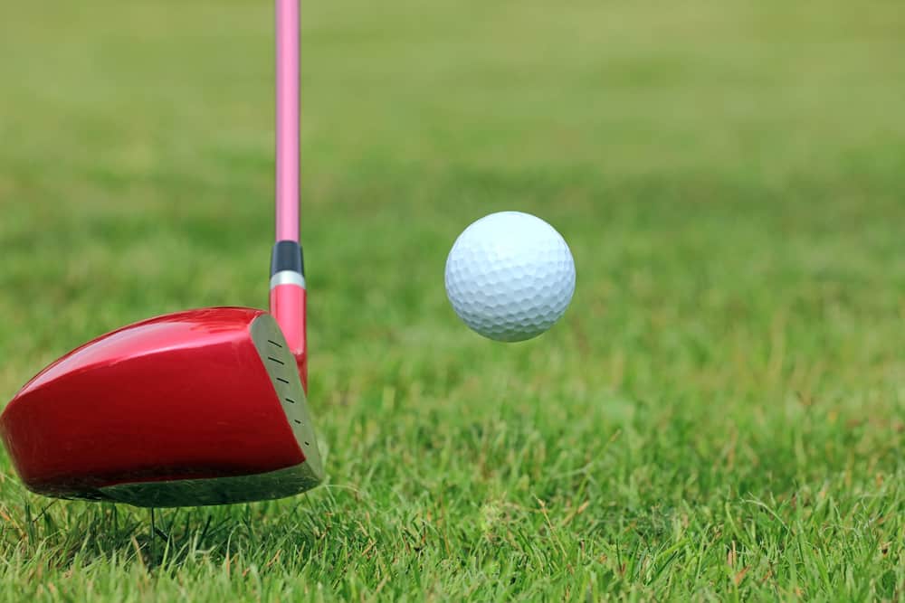 Driving Golf Ball off the Fairway on a Golf Course