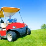 Man Driving A Golf Cart