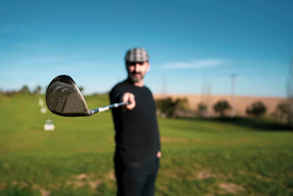 golfer holding a golf club