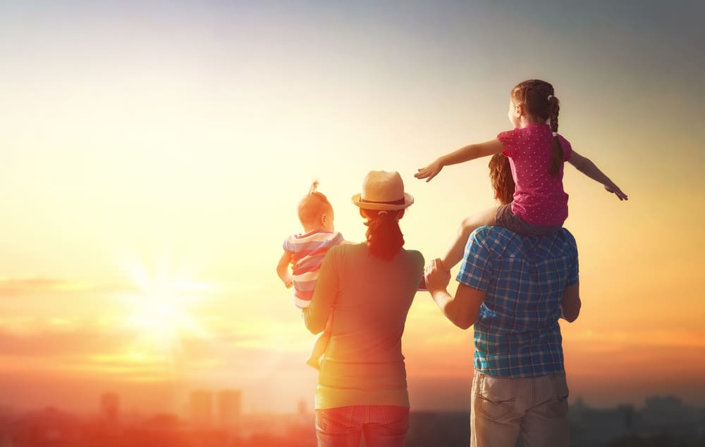 happy family at sunset