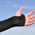 Arm Wrapped in a Black Wrist Brace