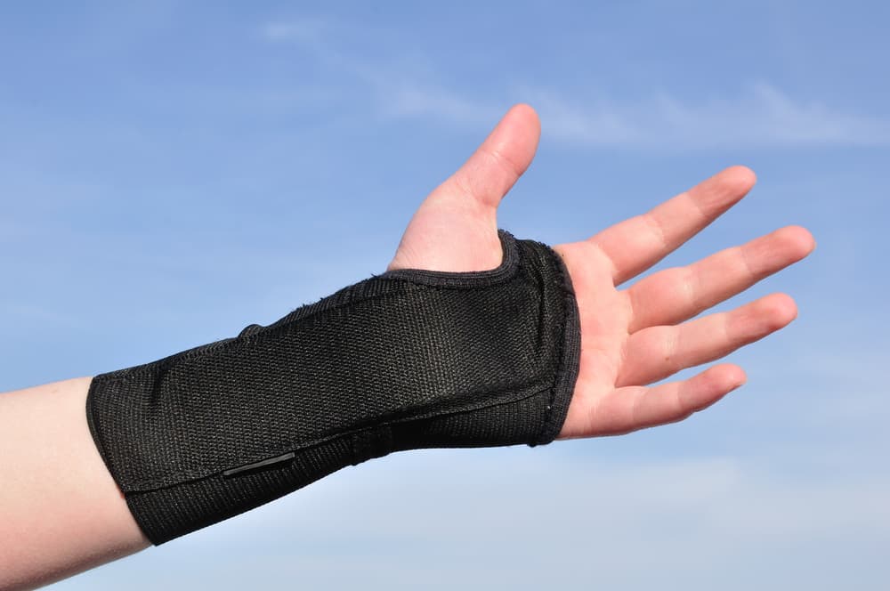 Arm Wrapped in a Black Wrist Brace