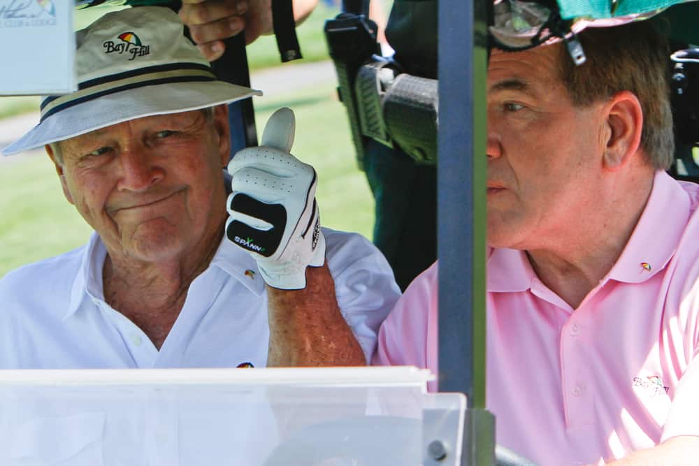 Arnold Palmer and Tom Ridge during a practice round