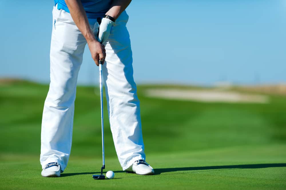 Golf club and ball. Preparing to shot