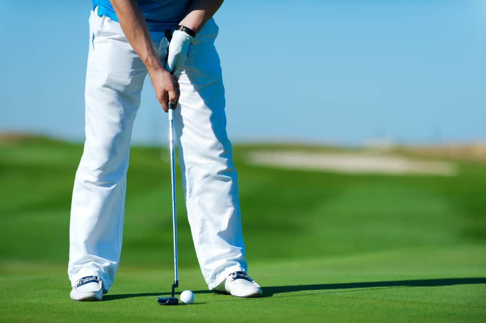 Golf club and ball. Preparing to shot