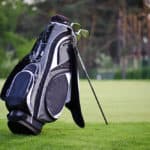 Golf sticks bag standing on golf course