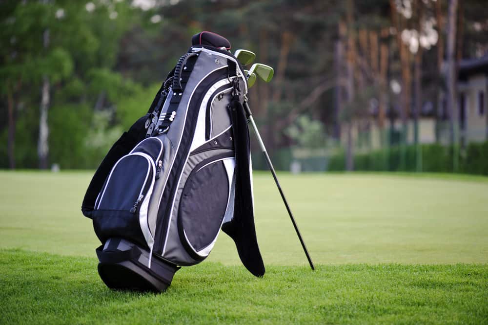 Golf sticks bag standing on golf course