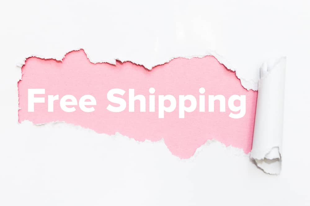 Pink hole in white paper. Free shipping