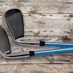 Two golf clubs on wood