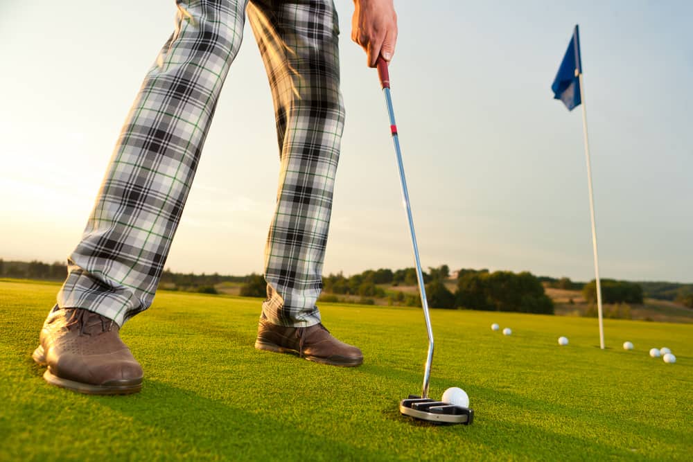 golfer with golf club during putting