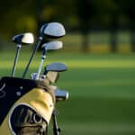 A set up new golf clubs on a beautiful golf course