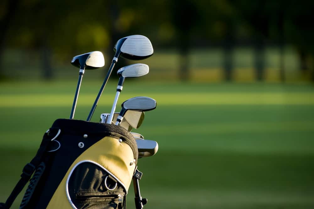 A set up new golf clubs on a beautiful golf course