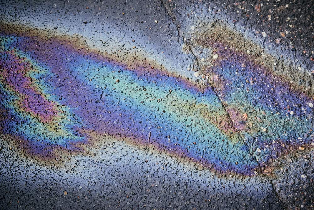 Gas stain on wet asphalt