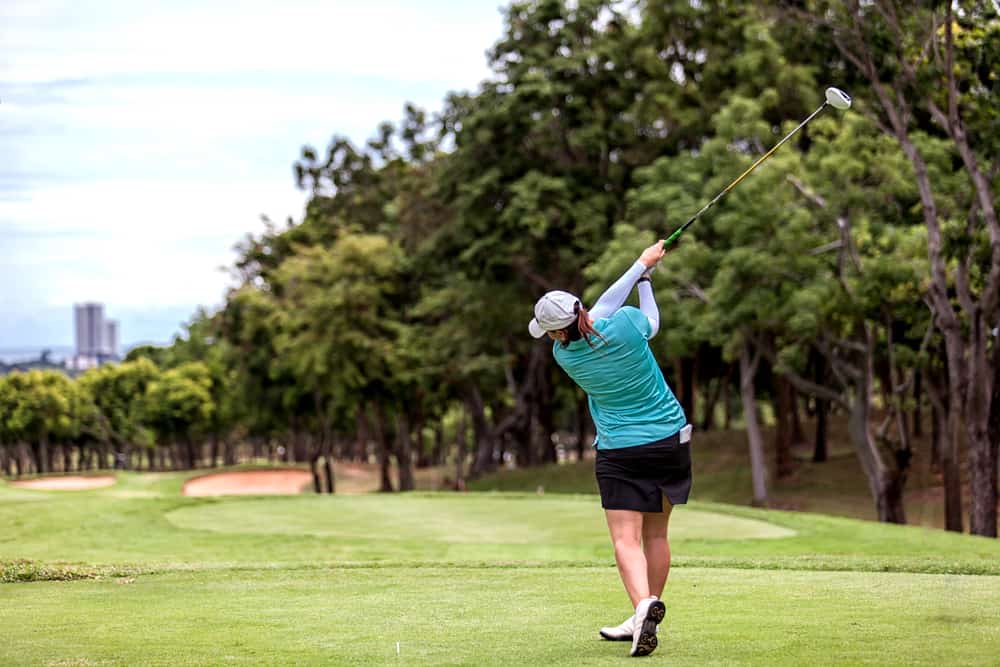 Left Hand Golfer Tee Off with Driver