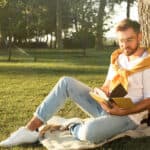 Young man reading book