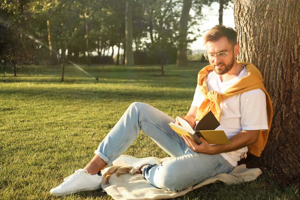 Young man reading book