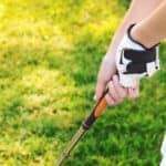 woman hand gripping golf club