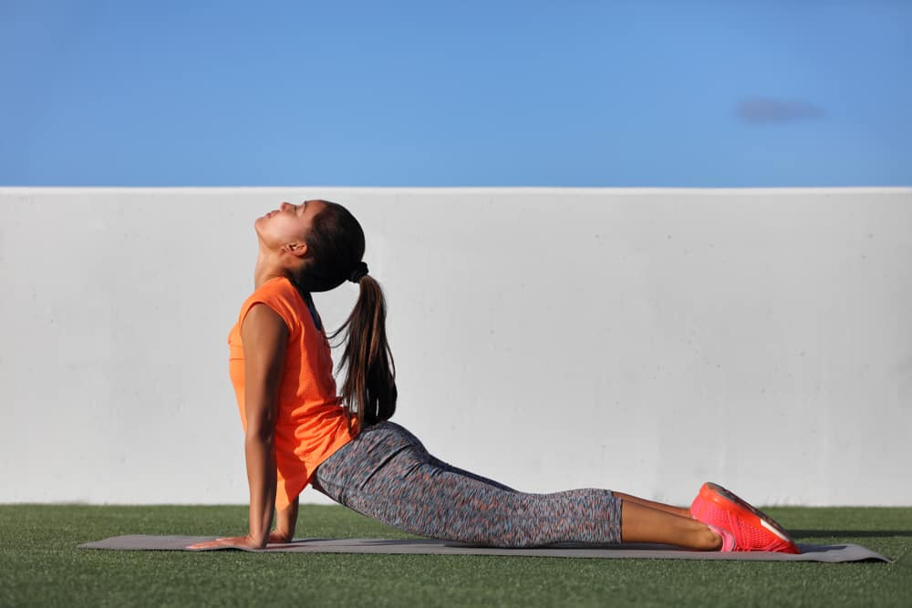 Fitness yoga woman stretching practicing morning sequence