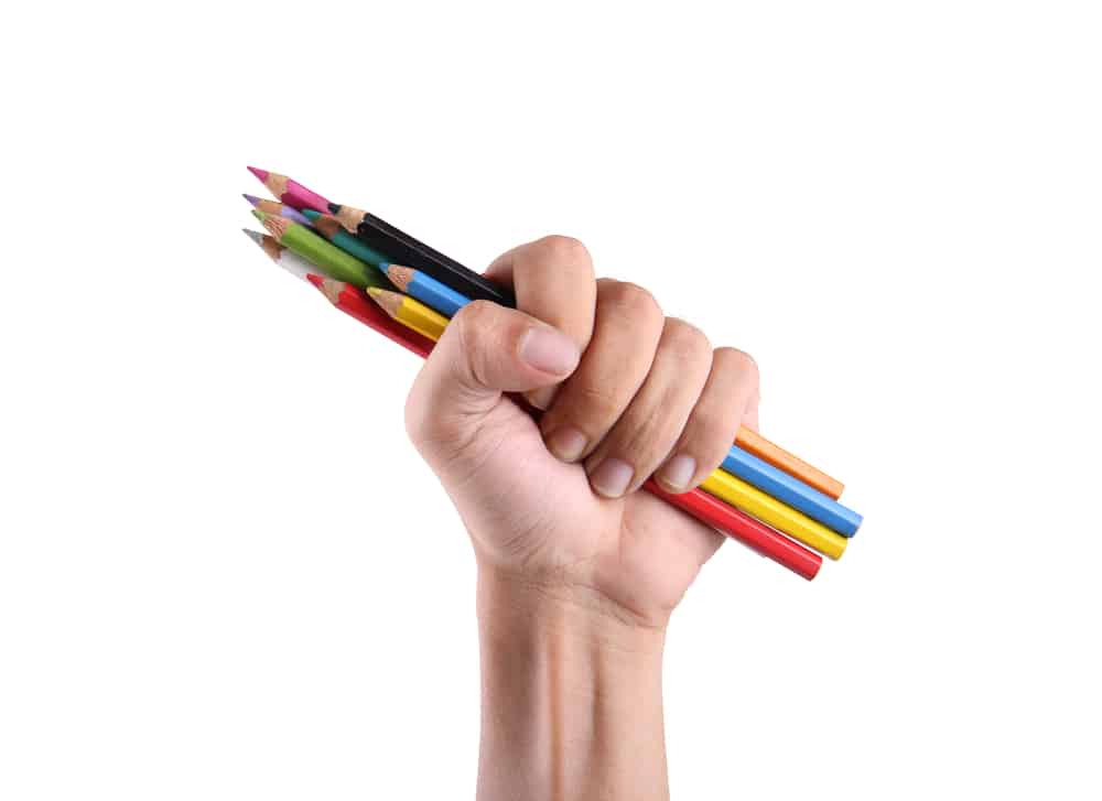 A hand gripping a bundle of coloring pencils