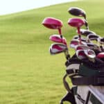 Close up of bag full of different golf clubs