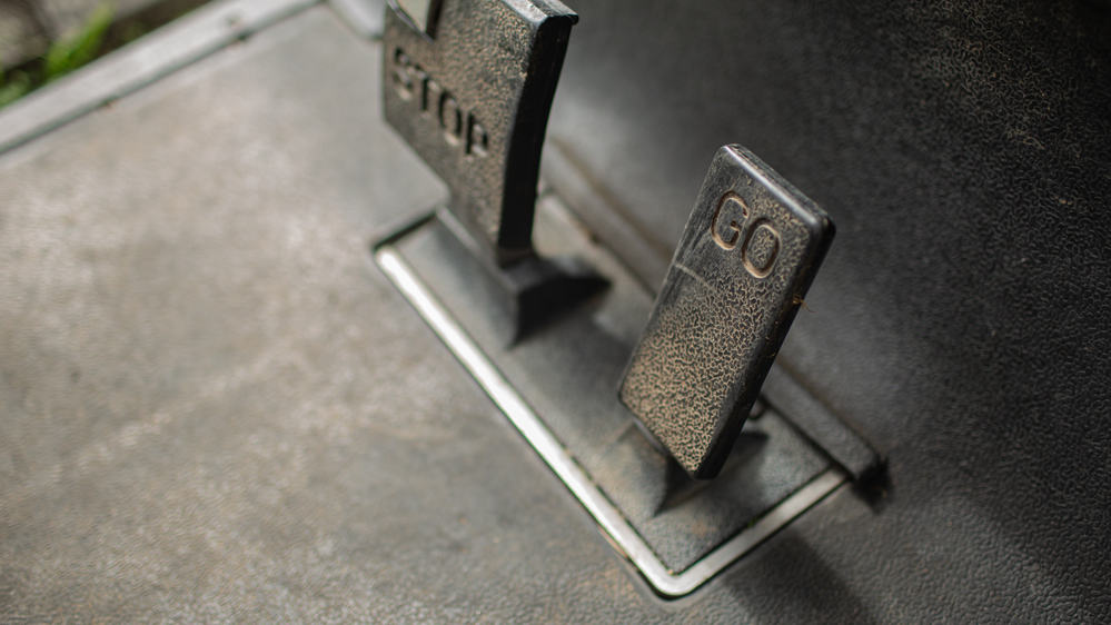 Close-up view of stop and go pedals in golf car