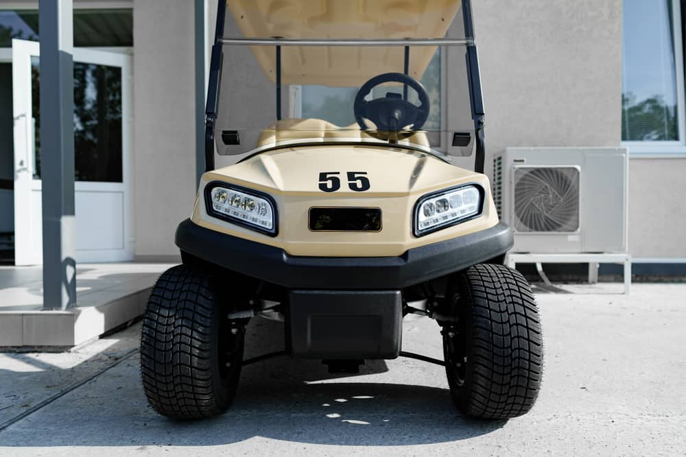 Electric golf car parked near hotel building