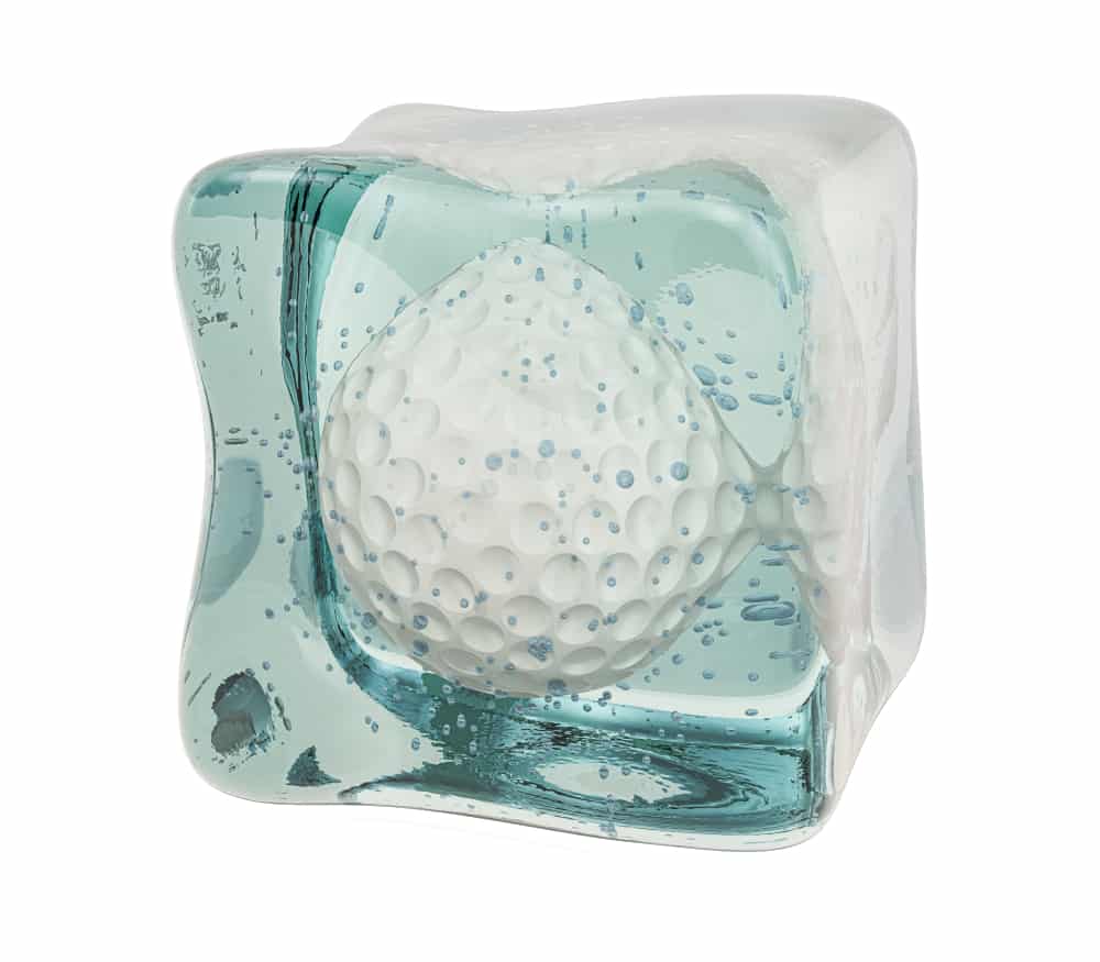 Golf ball frozen in ice cube