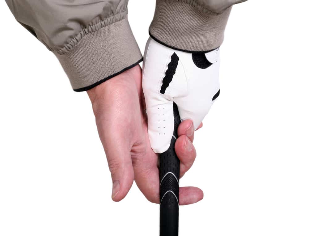 Man preparing to grip a golf club