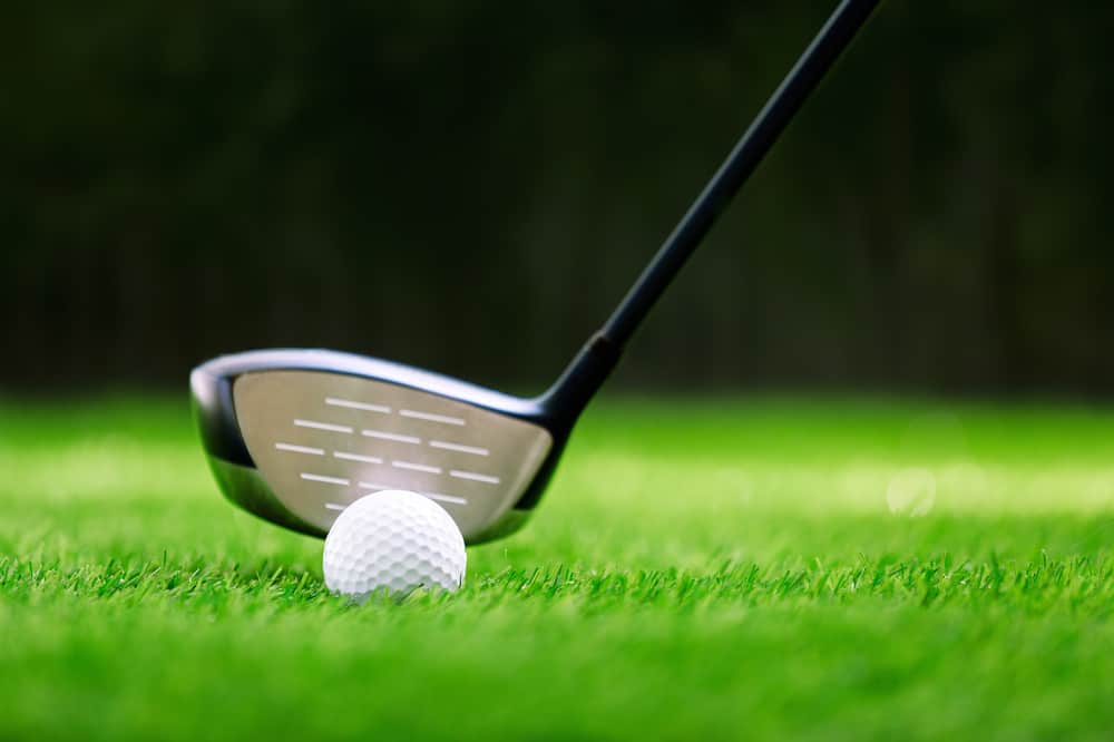 Shot of golf ball with golf club