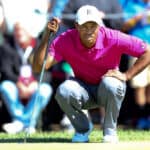 Tiger Woods lines up a putt