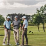 friends playing golf