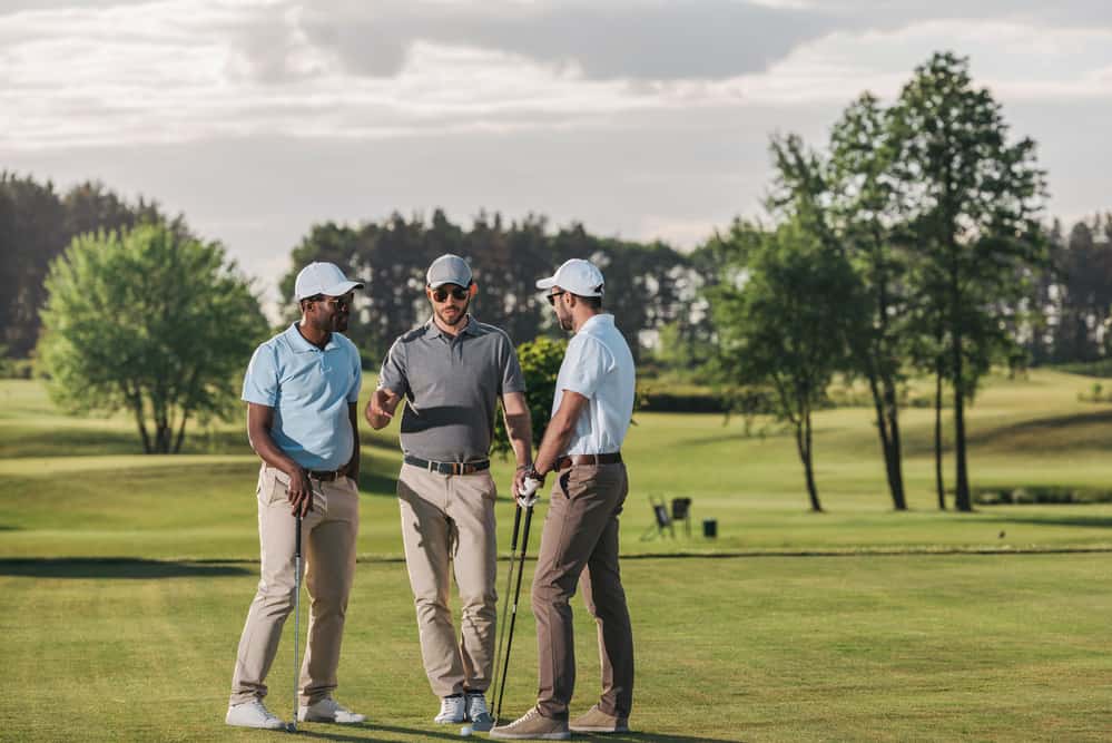 friends playing golf