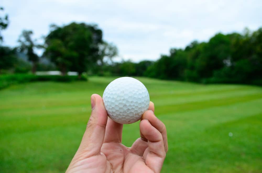 golf ball in hand